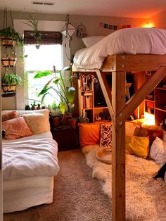 a loft bed is in the middle of a room with lots of plants on it