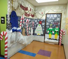 Decorated school door with Elf movie theme. Classroom Christmas Photo Booth, Buddy The Elf Window Display, Buddy The Elf Narwhal, Elf Desk Decorations, The Movie Elf Decorations, Elf Christmas Office Decorations, Elf The Movie Office Decorating Ideas, Elf Movie Bulletin Board, Movie Elf Decorations