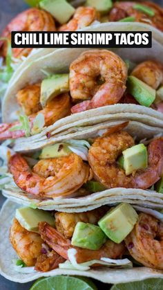 shrimp and avocado tacos with lime wedges