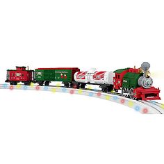 a green and red toy train traveling down tracks