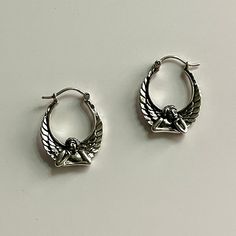 "ITEM: Solid Sterling Silver Angel Hoop Earrings ( I made these from a 1980's Vintage mold) All my Cherub/Angel earrings are made with the great attention to detail and all are made by hand. THESE ARE NOT HOLLOW THEY ARE SOLID STERLING SILVER- (As you can tell from the weight) COMPOSITION: Sterling Silver CONDITION: New WEIGHT: 7.1 Grams MEASUREMENT: Hoop with Angel - 1\" height x 3/4\" mm wide MARKS: 925" Handmade Vintage Metal Hoop Earrings, Vintage Nickel-free Small Hoop Earrings, Vintage Small Hoop Earrings, Vintage Nickel-free Metal Hoop Earrings, Vintage Metal Hoop Earrings As Gift, Vintage Sterling Silver Hoop Earrings With Ear Wire, Small Hoop Retro Earrings For Pierced Ears, Vintage Nickel-free Hoop Earrings, Vintage Small Hoop Metal Earrings