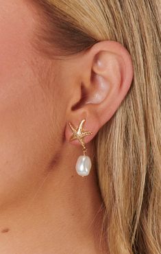 Check out Faithy Jewels Seaside Earrings ~ Gold/Pearl. Get $10 off + free shipping with Club Mumu. Gold Jewelry For Summer Beach Weddings, Gold Jewelry For Beach Wedding In Summer, Elegant Drop Earrings For Vacation, Ocean-inspired Jewelry For Vacation, Elegant Starfish Charm Jewelry For Vacation, Elegant Summer Jewelry With Starfish Charm, Ocean-inspired Dangle Hoop Earrings For Beach, Elegant Starfish Earrings For Summer, Ocean-inspired Pearl Drop Earrings