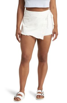 Show off your stems in this clean-white skort designed with a wrapped-and-tied front. 13" length; 2 1/2" inseam; 24" leg opening (size 2) 100% cotton Dry clean or machine wash, tumble dry Imported Spring Cutoff Skort With Built-in Shorts, Fitted Cotton Cutoff Skort, Chic Mini Length Cotton Jean Shorts, White High-waisted Skort With Built-in Shorts, Spring Cotton Skort With Frayed Hem, Chic Cotton Cutoff Shorts, Spring Cotton Skort In Short Length, Cotton Cutoff Shorts For Day Out, Spring Cotton Short-length Skort