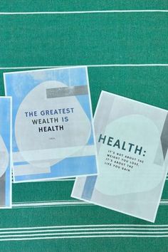 three pamphlets are laying on top of a green tablecloth with white and blue designs