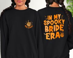 two girls wearing black sweatshirts that say in my spooky bride era