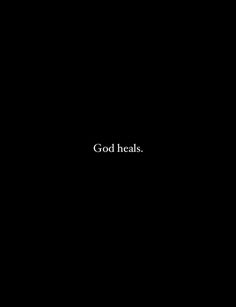 the words god heals are written in white on a black background