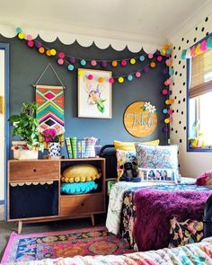 a bedroom decorated in bright colors and decorations