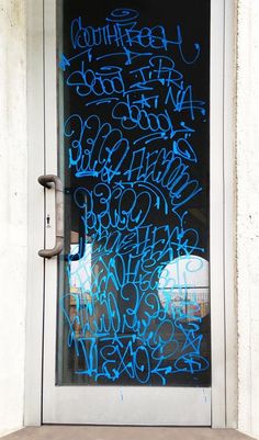 a door with graffiti written on it