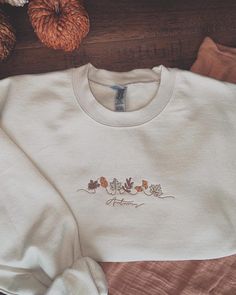 Cute fall embroidered sweatshirt!  Sweatshirt can be tan or green!  Perfect for the fall season!!  Unisex sizing. True to size. White Sweater With Custom Embroidery For Fall, Embroidered Crew Neck Sweater For Fall, White Custom Embroidered Sweater For Fall, Cream Crew Top For Fall, Brown Crew Neck Sweatshirt For Fall, Winter Embroidery Sweatshirt, Beige Crew Neck Sweatshirt For Fall, Cream Crew Neck Sweatshirt For Fall, Cream Cotton Sweatshirt For Fall