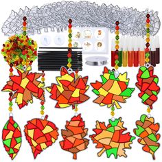 an assortment of stained glass fall decorations and accessories for the holiday season, including autumn leaves