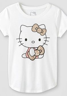 a hello kitty t - shirt with a donut in the shape of a bow