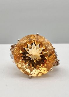 Designer 10k Yellow Gold Natural 13.20ct Citrine & Diamond Floral Ring Ring Size: 8 - Can Be Resized Metal: 10k Yellow Gold - Tested & Hallmarked Weight is 7.1 Grams on my scale  Ring is 17.5mm Wide Amazing Natural 13.20ct Round Fancy Cut Citrine & Diamond Gemstones In Great Condition, Any Questions Please Feel Free to ask Thank you Orange Topaz Round Ring, Luxury Orange Topaz Round Ring, Luxury Orange Round Topaz Ring, Luxury Orange Topaz Ring, Engagement Rings Citrine, Citrine Engagement Ring, Citrine Ring Engagement, Yellow Diamond Ring, Victorian Engagement Rings