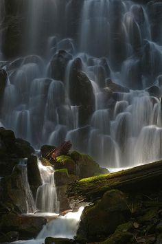 a waterfall with lots of water flowing down it