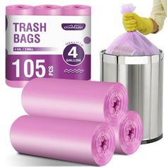 two rolls of pink trash bags next to a garbage can