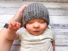 a small baby wearing a knitted hat