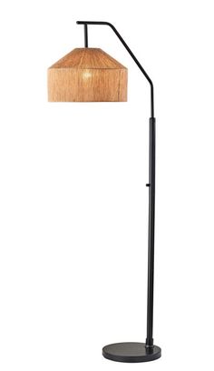 a floor lamp with a wooden shade on the top and black metal base, against a white background