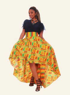 Perfect for your next invite, our African Print High Low Mimi Skirt features the traditional Kente fabric cut in a fitted waist and a stunning high-low hem style. Brights colors to brighten your day and mood. Features: * Yellow, Green, and Red African Print High Low Skirt * 3-inch waistband for a fitted waist * Pleated all around Average skirt length is 47 inches long * Center back zipper * Comes with 2 pockets * Fabric is 100% woven cotton * Made in Nigeria Care instructions: Han... Kente Skirt, Red African Print, African Skirt, African Print Maxi Skirt, Kente Dress, Ankara Skirt And Blouse, Mini Skirt Style, Style Africain, African Print Skirt