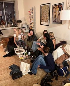 a group of people sitting around in a living room