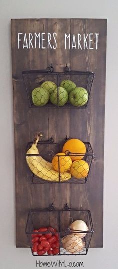 a sign that says farmers market with fruits and vegetables on it, hanging from the wall