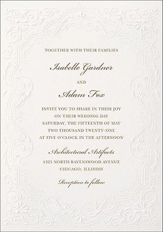 an ornate white wedding card with gold lettering