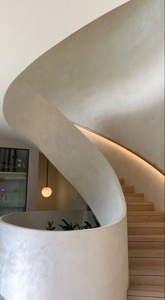 a white spiral staircase in a modern home