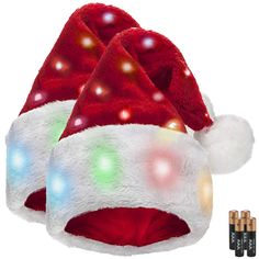 a red and white santa hat with lights on the inside, sitting up against a white background