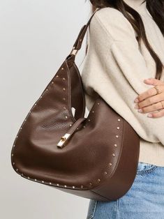 Vegan Leather Bag Turn-lock Loop Closure Stud Details Gold Hardware Exterior Zip Pocket Interior Zip Pocket 2 Interior Slip Pockets 📦 Free standard shipping on orders $150 or more 🛍️ Free in-store pick up at La Grange Shopping Tote Bag With Turn-lock Closure, Luxury Shoulder Bag With Snap Closure For On-the-go, Brown Shoulder Bag With Turn-lock Closure And Double Handle, Brown Double Handle Shoulder Bag With Turn-lock Closure, Brown Crossbody Bag With Silver-tone Hardware, Brown Top Handle Shoulder Bag With Gunmetal Hardware, Brown Leather Bag With Turn-lock Closure, Brown Top Handle Shoulder Bag With Snap Closure, Shopping Shoulder Bag With Turn-lock Closure