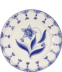 a blue and white plate with flowers on it