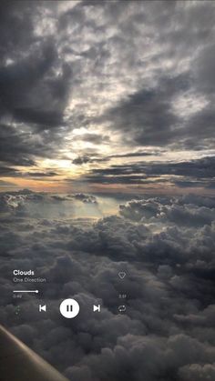 the view from an airplane looking down on clouds