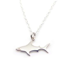 PRICES MAY VARY. Elegant Shark Pendant: This necklace features a stylish alloy shark pendant, showcasing a sleek and modern design that complements any outfit. Durable Material: Crafted from high-quality alloy, this necklace is resistant to tarnishing and suitable for everyday wear. Lightweight and Comfortable: Weighing just 0.08oz, this necklace offers lightweight comfort, making it ideal for all-day wear without feeling heavy. Adjustable Length: The chain measures 17.7 inches (45cm) in length, Shark Pendant, Gold Clothing, Shark Necklace, Animal Necklace, Sea Animal, Pet Necklace, Jewelry Design Necklace, Ocean Animals, Sea Animals