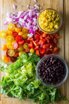 the ingredients for this salad are laid out on a cutting board and ready to be eaten