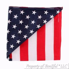 an american flag is folded on top of a white background with red, white and blue stars