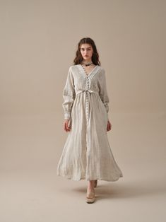 Chic Daywear Linen Dress With Buttons, Chic Linen Dress With Buttons For Daywear, Chic Linen Day Dress With Buttons, Chic Neutral Dresses With Buttons, Chic Linen Midi Dress With Buttons, Cream Buttoned Dress For Daywear, Cream Button Dress For Daywear, Neutral Buttoned Dress For Spring, Neutral Spring Dress With Buttons