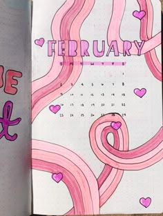 a pink spiral notebook with the word february written in cursive writing on it