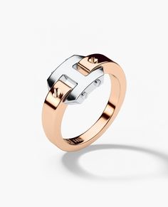 We will send you a size verification email once the purchase is completed. The minimalist version of our beloved Briggs design, this ring features a singular briggs link supported by a solid gold band. Signature Rockford screws can be found on either side of the Briggs link. This Rockford mini has a traditional fit and can be customized with any engraving of your choice. Modern Rose Gold Sterling Silver Ring, Modern Rose Gold Rings With Polished Finish, Modern Rose Gold Signet Ring With Polished Finish, Luxury Rose Gold Rings With Tension Setting, Modern Rose Gold Signet Ring With Round Band, Luxury Rose Gold Tension Setting Ring, 10k Engagement Ring, Pinky Signet Ring, Black Diamond Bands