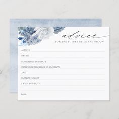 a blue and white wedding advice card with watercolor flowers on the front, sitting on top of a marble surface