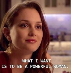 a woman with long hair wearing earrings and a quote on her face that says, what i want is to be a powerful woman