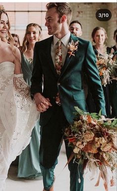 a bride and groom walking down the aisle