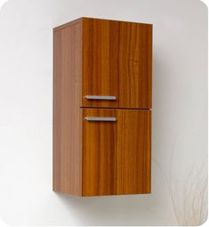 a wooden cabinet mounted to the side of a wall