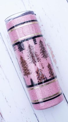 pink glitter tumbler with trees on it