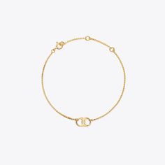 Empowering women. Made of fine silver or gold vermeil chain and detailed with a Gemini Link charm, our bracelet symbolizes a shared bond and the impact of collaboration. 100% of net proceeds benefit the Tory Burch Foundation, which supports women entrepreneurs with access to capital, education, digital resources and a networking community. Whether you wear one or share one, join us in our mission to empower women and women entrepreneurs. Gold Sterling Silver Cable Chain Bracelet, Gold Sterling Silver Bracelet With Cable Chain, Adjustable Sterling Silver Chain Bracelet In Yellow Gold, Luxury Delicate Chain Gold Bracelet, Designer Bracelets, Tory Burch Jewelry, Women Entrepreneurs, The Embrace, Empower Women