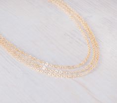 "~ Simplicity Choker~ Dainty choker chain, you can choose 1, 2, 3 layers as shown; all layers are attached to one clasp and can't be separated. This choker necklace can be layered with your other necklace collection and also be worn alone. Comes with 3\" extension chain ▸▸ Material ◂◂ All components are 14K gold filled. ▸▸ Layers◂◂ Comes in 1 / 2 / 3 layers, choose the number of layers you want. ▸▸ Necklace Length ◂◂ 13\" + 3\" extending chain. Leave a note at checkout if you want a different le Yellow Gold Chain Choker As Gift, Dainty Layered Cable Chain Necklace For Gifts, Delicate Chain Link Choker, Delicate Chain Link Choker Gift, Delicate Chain Link Choker For Gift, Gift Delicate Chain Link Choker, Delicate Layered Chain Necklace As Gift, Delicate Layered Chain Necklace Gift, Delicate Chain Layered Link Necklace As Gift