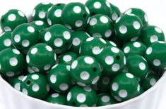 green and white polka dot beads in a bowl