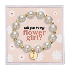 a bracelet that says will you be my flower girl? with pearls and gold accents