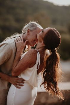 Romantic couple portrait of two brides smiling as they lean in for kisses during golden hour Couple Shots Wedding, Wedding Day Photo Ideas, Meredith Blake, Shots Wedding, Golden Hour Wedding, The Parent Trap, Bride Photos, Ibiza Wedding