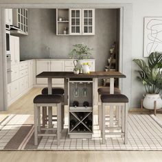 a dining room table and chairs in a kitchen with white cupboards on the wall