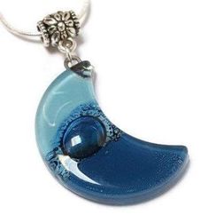 Baby blue and Blue moon shape glass pendant The Glass bead is approx 1.25'' long and .75'' wide. The chain is approx 18 inches long. Silver Plated "snake" chain with a lobster claw clasp. (if you need a longer chain please send a note with your purchase) All the jewelry is handmade out of recycled glass. This is real glass that comes from windows and other more traditional sources. The glass is cut and assembled, then fired in a kiln to fuse round sharp edges and improve the colors and texture o Fused Glass Necklace, Fused Glass Pendant, Fused Glass Jewelry, Moon Shape, Eco Friendly Jewelry, Homemade Jewelry, Moon Shapes, Pendant Design, Recycled Glass