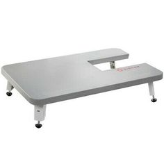 a white table with wheels on it and a gray top, in front of a white background