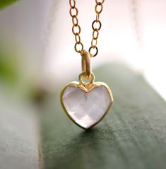 Looking for a unique accessory for some self love, or love for that special someone? Crafted from 14k gold filled and natural Rose Quartz, this pendant is the perfect, sparkling way to show anyone how much you care. Rose Quartz is a stone of love. It is believed to restore trust & harmony in relationships and encourage unconditional love. It purifies the heart and promotes self love, inner healing, and friendship. It is an alternate birthstone for January, as well as the spiritual birthstone for Handmade Rose Gold Heart Pendant Jewelry, Dainty Pink Gold Birthstone Jewelry, Dainty Pink Gold Gemstone Jewelry, Dainty Pink Gold Jewelry With Birthstone, Pink Gold Heart-cut Jewelry With Heart Charm, Pink Gold Heart Cut Jewelry With Heart Charm, Rose Gold Heart Pendant Necklace With Birthstone, Pink Gold Heart Pendant Jewelry With Heart Charm, Rose Gold Heart Necklace With Birthstone For Mom