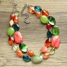 💞One of a kind & ready to ship💞  A color block collision of all my favorite green and coral beads! 16" long with a 4" extender chain. Silver accents and chain.   Thank you for supporting American small business!  *Smoke and pet free home* Hate waiting? Me too! I ship 6 days a week. This is READY TO SHIP!  Thank you for browsing my store! Green Beaded Necklace With Faceted Beads, Bold Handmade Green Jewelry, Green Double Strand Necklace With Colorful Beads, Vibrant Handmade Green Jewelry, Green Double Strand Necklace With Faceted Beads, Green Multi-strand Necklace With Colorful Beads, Green Multi-strand Beaded Necklace, Green Multi-stone Necklaces With Round Beads, Nature-inspired Multicolor Gemstone Bead Necklaces